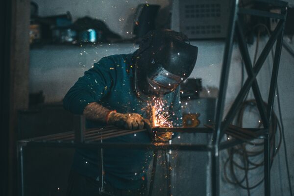 A welder with a mask.