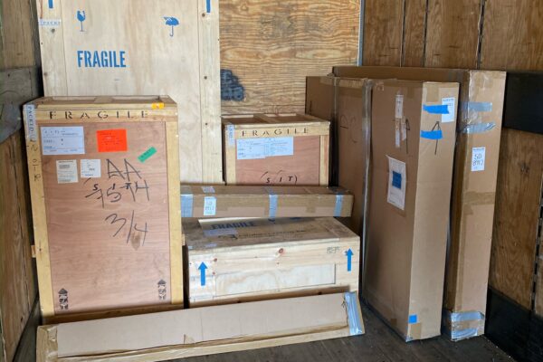 Wooden crates inside of a truck.