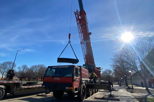 A large crane outside on a sunny day.